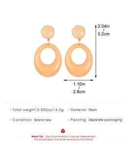 Detailed view of orange and pink resin hoop earrings with specific size measurements