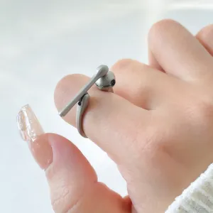 Unique matte silver bone claw ring with adjustable open band for a minimalist artistic look
