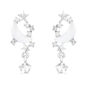Elegant silver star and crescent moon dangle earrings with sparkling crystal accents