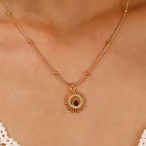 Golden tiger eye sunburst pendant necklace with beaded chain on female model