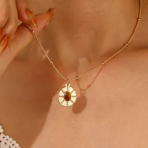 Tiger eye stone pendant necklace with gold beaded snake chain for women worn by model