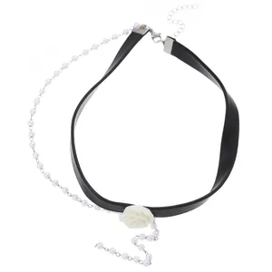 Detailed view of leopard rose choker with black leather cord and hanging faux pearls