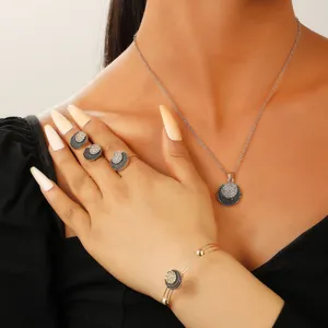 Detailed view of layered jewelry set with necklace and pearls on model