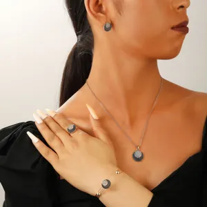 Detail of luxury geometric multi-layer faux pearl necklace and crystal jewelry set on model