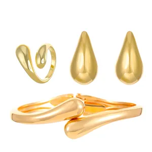 Detail view of Ag925 hallmark on polished gold-plated liquid metal jewelry set