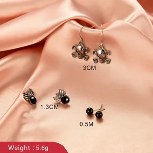 Halloween earring set with vintage silver skull pendants, black spider studs and bead studs