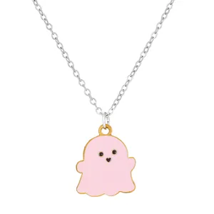 Detail of pink ghost pendant necklace with heart-shaped mouth and gold accents
