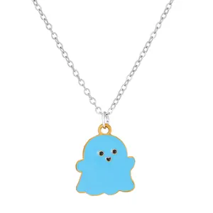 Close-up of blue cartoon ghost pendant with gold accents on a silver chain