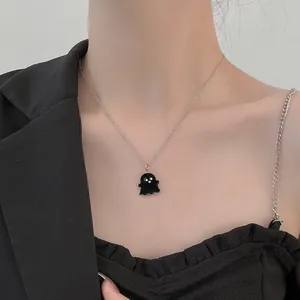 Minimalist silver chain necklace featuring a cute black cartoon ghost pendant for Halloween