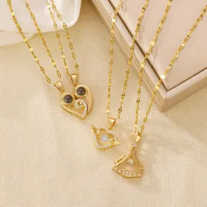 Golden heart projection necklaces with angel wings and diamond-encrusted pendant set