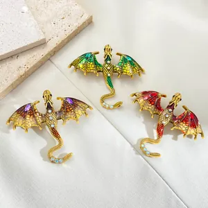 Detail of colorful dragon brooches with enamel finish and sparkling rhinestones