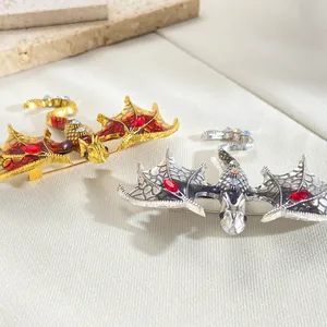 Detailed close-up of dragon brooches in gold and silver with colorful enamel and rhinestones