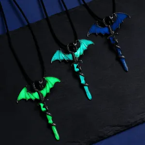Macro detail of three glowing dragon sword pendants in green, cyan and blue colors