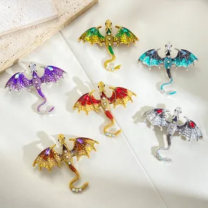Vintage enamel dragon brooches set with crystal rhinestones in six vibrant colors