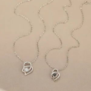 Silver heart necklace with 100 languages projection stone and romantic engraving