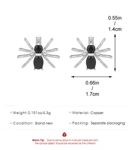Detailed view of silver copper spider earrings with black stones and size specifications