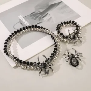 Gothic spider jewelry set with black beaded necklace and sparkling silver pendants