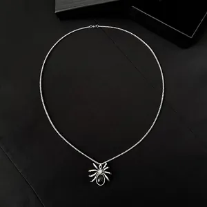 Gothic spider pendant necklace with black gemstone inlay and vintage silver metal finish