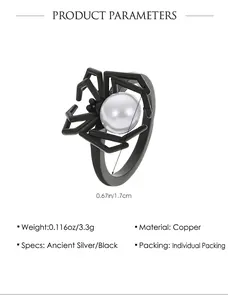 Detailed macro view of retro spider ring with white faux pearl inlay and copper base