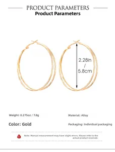 Detail view of large gold multi-layer hoop earrings with 5.8cm diameter specifications