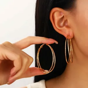 Three-layered large gold hoop earrings for women with minimalist multi-circle design