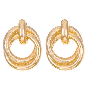 Vintage oversized gold-layered hoops with textured and polished concentric rings