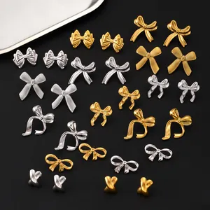 Elegante vergoldete Schleifen und X-förmige Ohrstecker aus Edelstahl in Gold und Silber