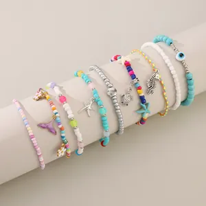Conjunto de tobilleras bohemias multicapa con colgantes de tortuga marina y estrellas