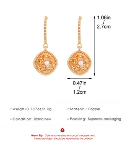 Detail view of gold-tone floral earrings with dimensions and material specifications