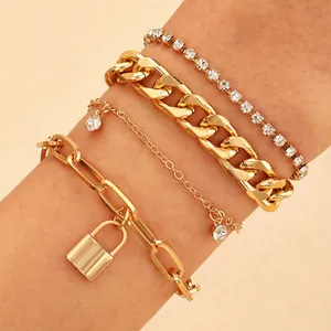Detail of 4-piece gold alloy bracelet set with punk style lock pendant and rhinestones