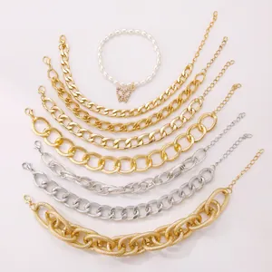 Detail of 4-piece punk gold and silver alloy bracelet set with butterfly pearl charm