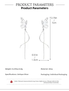 Detailed view of antique silver butterfly earrings with tassel design and measurements
