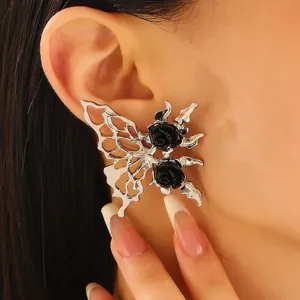 Detail of gothic silver butterfly earrings with black roses and hollow wing design
