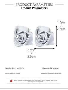 Detailed view of silver PU leather rose earrings showing textured 3D flower petals