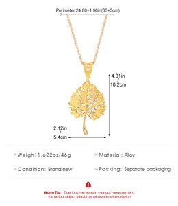Close-up of golden leaf pendant with sparkling rhinestones showing detailed dimensions