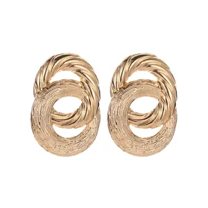 Golden double hoop C-shape earrings with twisted rope and hammered metal textures