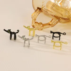Set of 6 cute cat-shaped ear cuffs in gold, silver, and black with green gem eyes