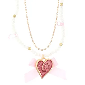 Double-layer crystal pearl necklace with pink heart pendant and silk bow choker