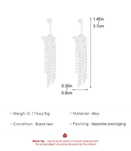 Detailed view of silver bow tassel earrings with dimensions 3.7cm long and 0.9cm wide