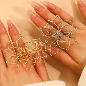 Detailed macro shot of layered silver and gold woven lotus rings with openwork design