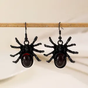 Gothic spider drop earrings with red gemstone and black lacquer for Halloween styling