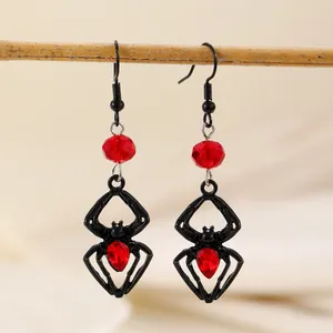 Gothic spider drop earrings with red faceted crystal accents for Halloween styling