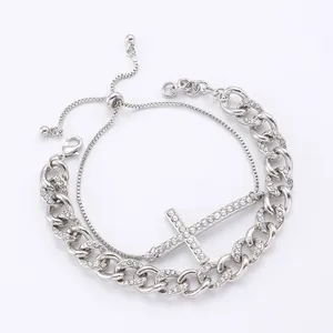 Silver layered Cuban chain and square link bracelet with rhinestone-encrusted cross