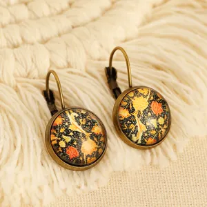 Boucles d'oreilles ethniques vintage avec métal bronze et motifs d'art abstrait