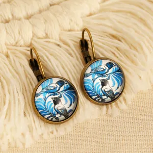Boucles d'oreilles vintage ethniques avec motifs d'oiseaux colorés et cadres en bronze