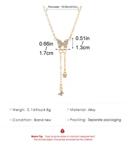 Detailed specs of gold Y-shaped butterfly necklace with rhinestones and alloy material