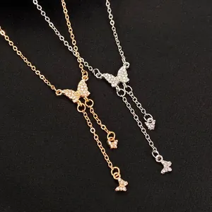 Vintage butterfly pendant necklace with sparkling rhinestones and long tassel chains in gold