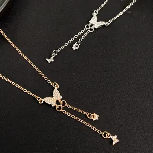 Vintage style butterfly necklace with tassels and sparkling rhinestones in gold and silver