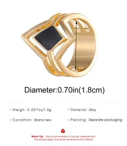 Detailed view of gold multi-layer geometric ring with black square oil drip inlay
