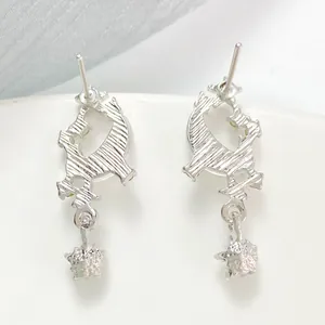 Elegant silver star and moon stud earrings featuring hollow textures and star pendant details